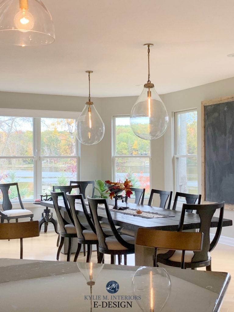 Benjamin Moore Revere Pewter in dining room with dark wood furniture and pendant lights. Best warm gray. Kylie M Interiors Edesign, client photo. Decorating blog