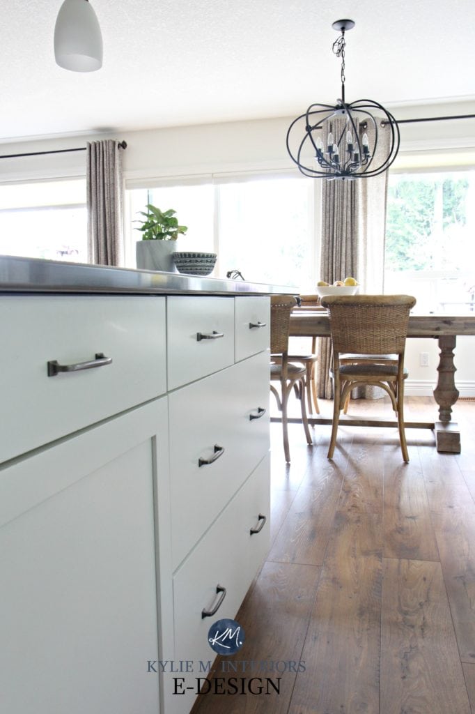 Kitchen island painted benjamin moore cloud white, before and after some time. View to open dining room. Kylie M INteriors E-design and online paint color expert