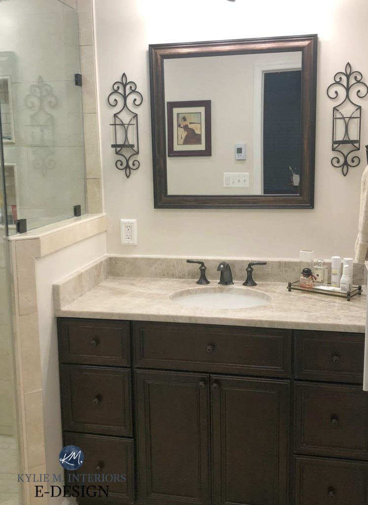 Bathroom vanity, travertine tile and countertop, espresso, dark wood, Benjamin Moore Ballet White cream. Kylie M INteriors Edesign, online paint color expert blog