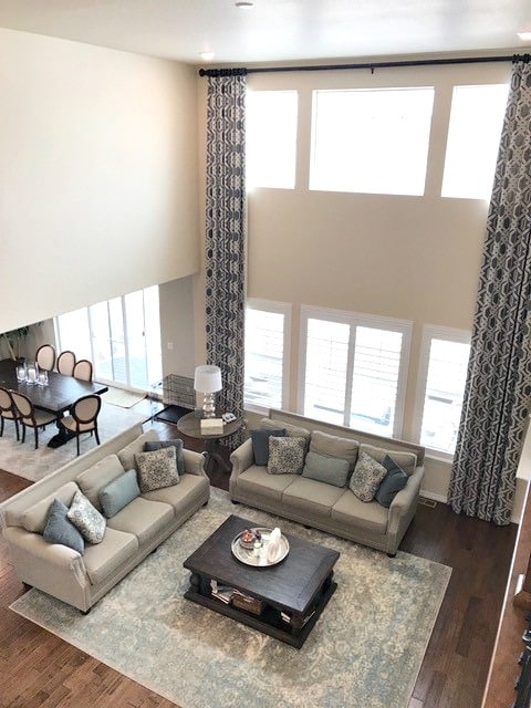 living room south facing, Navajo White Benjamn Moore greige furniture. Before Kylie M E-design