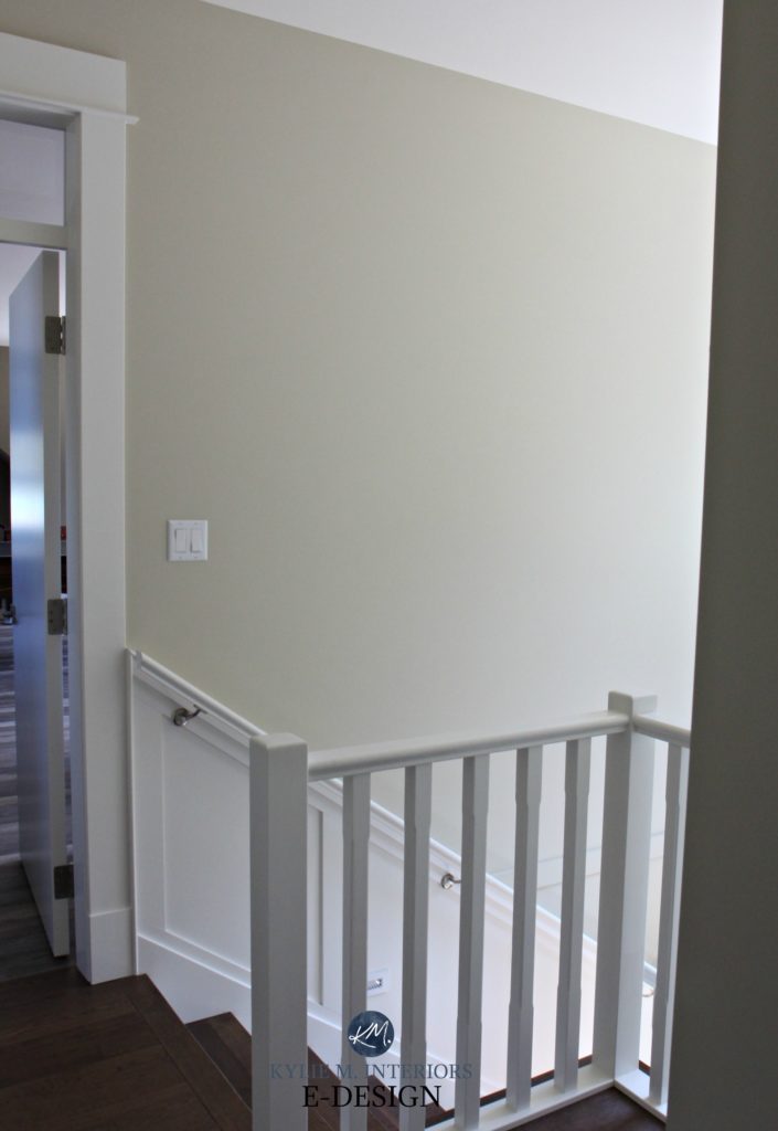 Sherwin Williams Wool Skein, south facing stairwell hallway, white wainscoting. Kylie M Interiors Edesign, online virtual paint color consulting