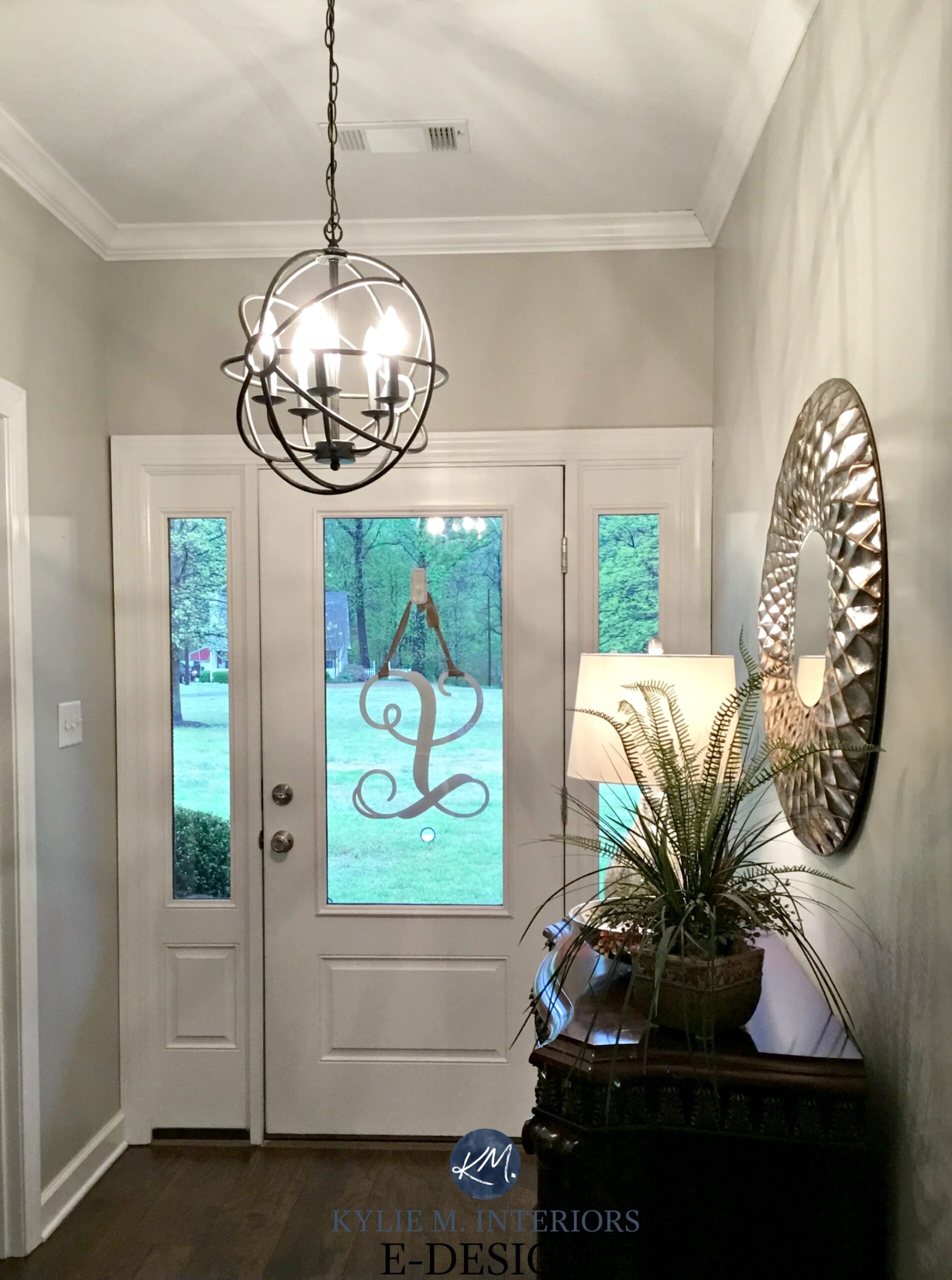 Sherwin Williams Anew Gray entryway, Greige paint colour, white front door, chandelier and mirror. Kylie M INteriors Edesign, virtual online paint colour consulting. Client before photo
