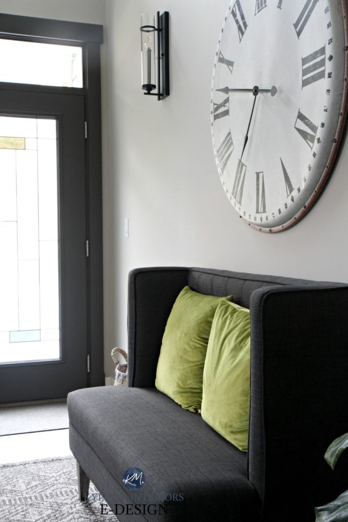 Entryway in Sherwin Williams Collonade Gray with oversized large clock, charcoal bench seat and foyer front door painted Urbane Bronze. Kylie M INteriors Edesign, online paint color expert - Copy