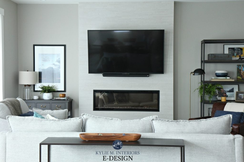 Sherwin Williams Collonade Gray in living room. Kylie M Interiors Edesign. Tv above electric fireplace with tile surround. Transitional style home decor - Copy