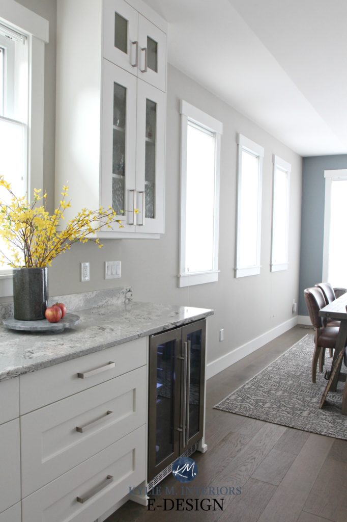Sherwin Williams Collonade Gray in north facing kitchen with Alabaster cabinets, Summerhill quartz. Gibraltar Cliffs feature wall. Kylie M INteriors Edesign