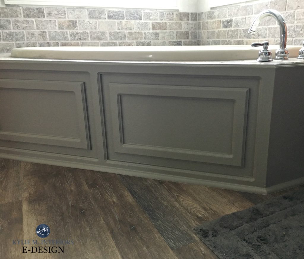 Almond or bone bathroom tub and fixtures with Mega Greige painted surround and travertine tile accent. Kylie M interiors Edesign, client before photo