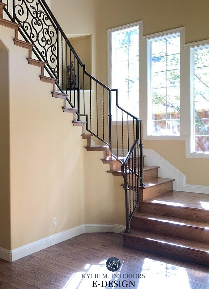 Benjamin Moore Desert Tan walls and Timid White trim in staircase with red oak flooring. Walls need a bit more pink in them. Kylie M Interiors Edesign, online paint color consultant