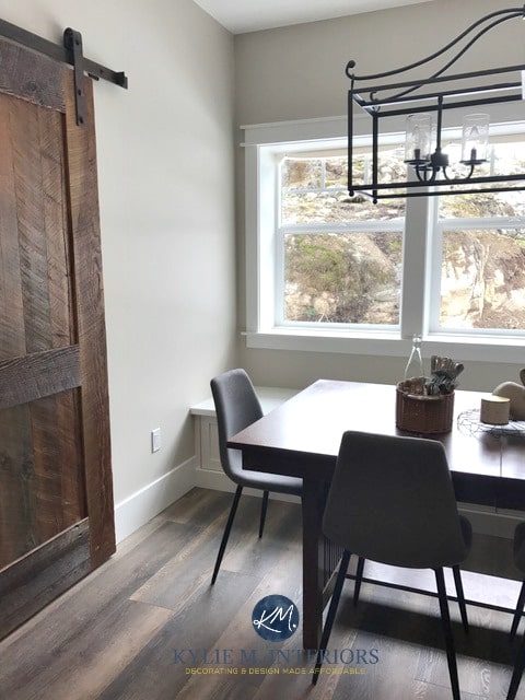 Benjamin Moore Baby Fawn, Edgecomb Gray in dining room, farmhouse style sliding barn door and chandelier. Kylie M INteriors E-design and online color or e-decor blog