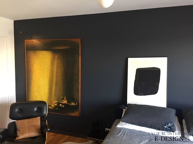 Benjamin Moore Raccoon Fur feature accent wall with Pure White and art gallery style display in bedroom. Kylie M INteriors Edesign, online paint color specialist