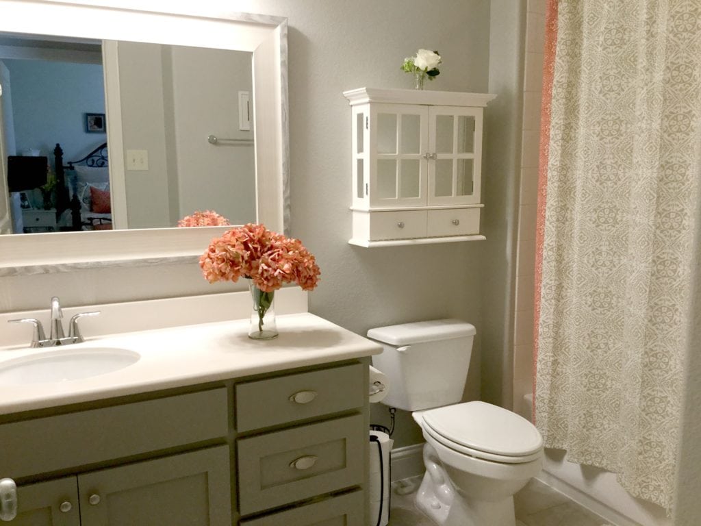 Budget friendly affordable bathroom update ideas. Painted vanity, home decor accents, shower curtain. Kylie M Interiors Edesign, online paint color consulting and diy advice