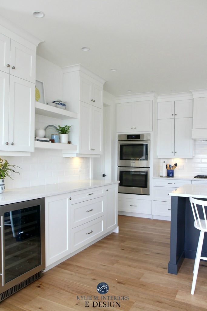 Kylie M Interiors Edesign. Pure White kitchen cabinets, white oak flooring, prep station, wine fridge and floating shelves