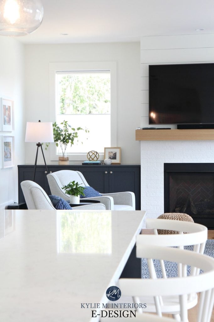 Kylie M Interiors, online paint colour consultant. Living room with shiplap and fake white brick fireplace and tv. Pure White walls and trim, built in cabinet in Cyberspace