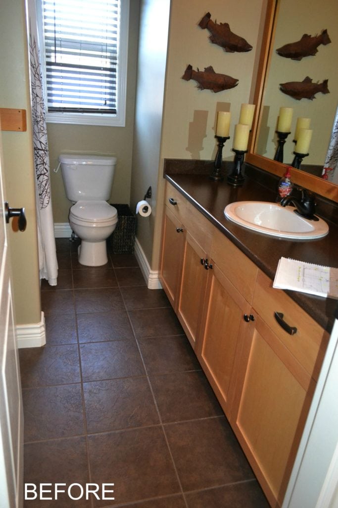 Maple cabinets in bathroom before being updated with paint and countertop