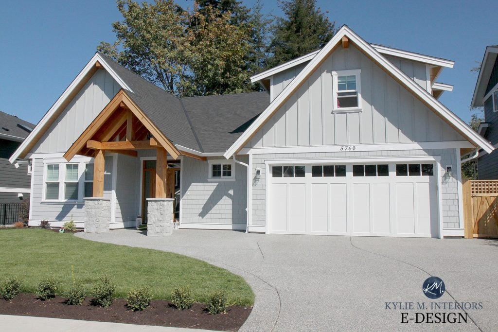 Gray exterior with hardi siding and white trim, garage doors and windows. Wood beams and entryway, board and batten and shakes. Kylie M Interiors Edesign, online paint color consulting