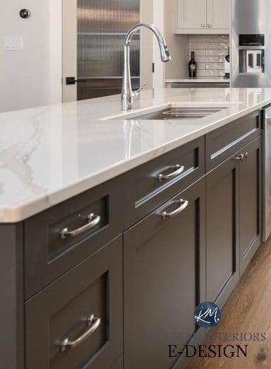 Kitchen island painted dark gray green, Brittanica Warm quartz countertop, warm gray cabinets. Kylie M Interiors Edesign, online paint color advice