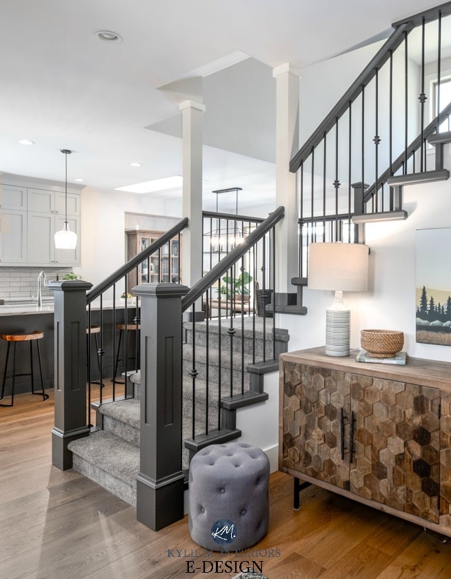 Staircase in entryway with painted hand railing and carpet on stairs. White oak flooring and open to kitchen. Kylie M Interiors Edesign, online paint colour advice blog and consulting