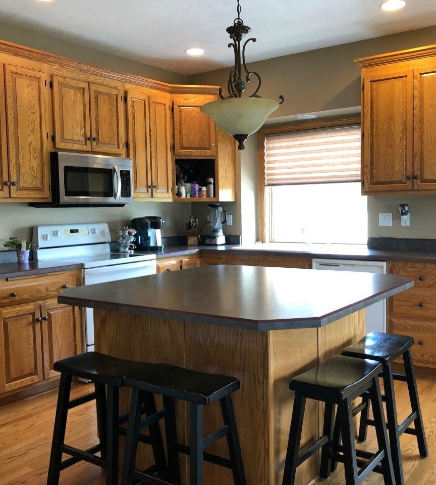 oak kitchen cabinets stained, not painted, before new countertop and backsplash