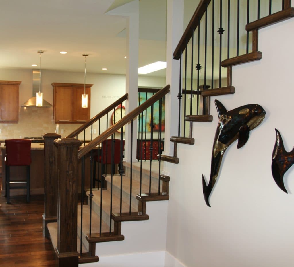 Staircase in entryway with painted hand railing and carpet on stairs. White oak flooring and open to kitchen. Kylie M Interiors Edesign, online paint colour advice blog and consulting