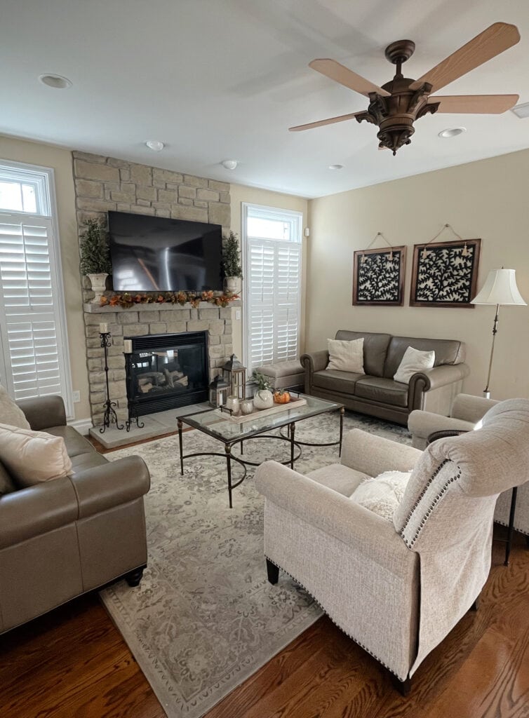 Sherwin Williams Kilim Beige, best beige paint color, neutral stone fireplace, warm tan furniture, home decor, Kylie M client photo