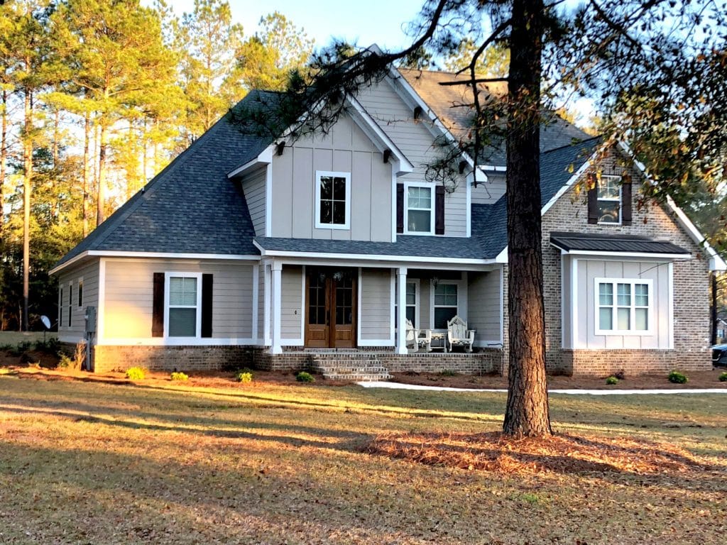 Exterior before painted. Benjamin Moore Stone Hearth. Separate garage. (1)
