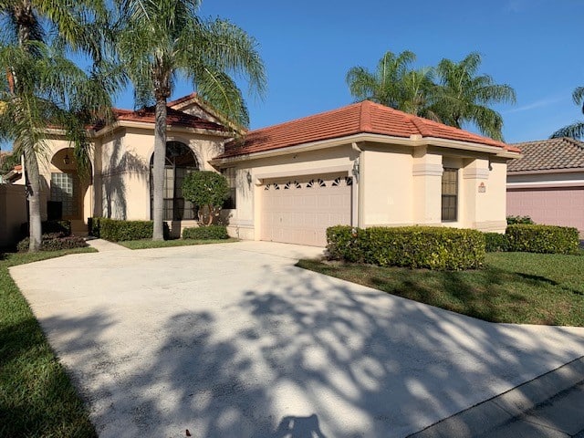 Exterior, red terra cotta roof, stucco before being painted with Kylie M Interiors Edesign