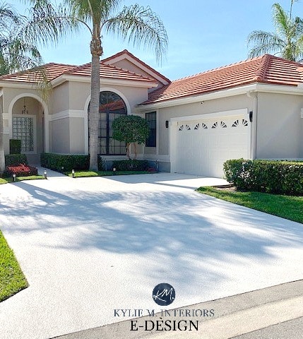 Exterior, red terra cotta tile orange roof with greige stucco, off-white trim and garage door. Kylie M Interiors Edesign, online paint colour consultant. Best exterior paint colors