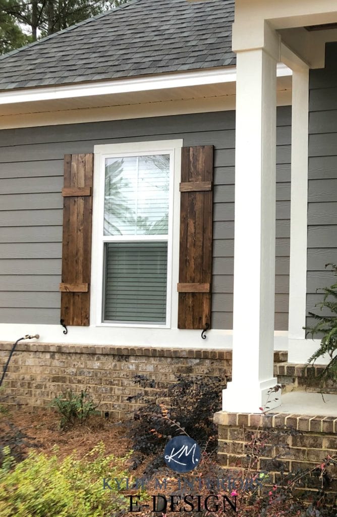 Exterior siding, Sherwin Williams Gauntlet Gray, Pure White trim, brown brick, wood shutters minwax. Kylie M Interiors Edesign, online paint colour coach advice