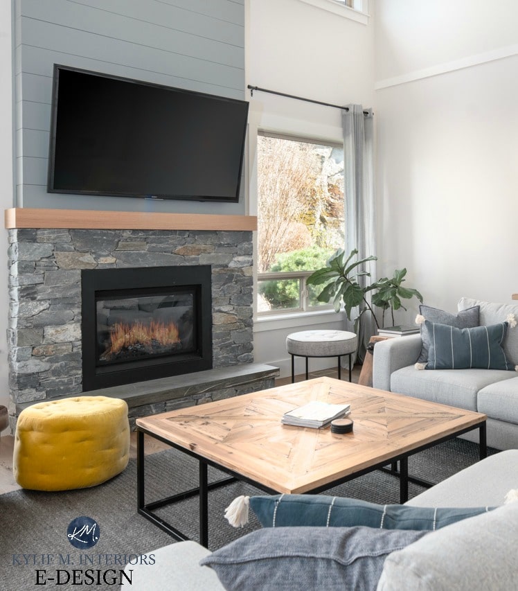 Livingroom vaulted ceiling, stone and shiplap fireplace with TV, off-white greige walls decor in grays, greens and blues. Kylie M Interiors Edesign, online paint colour. Diy decorating and design blog and ideas