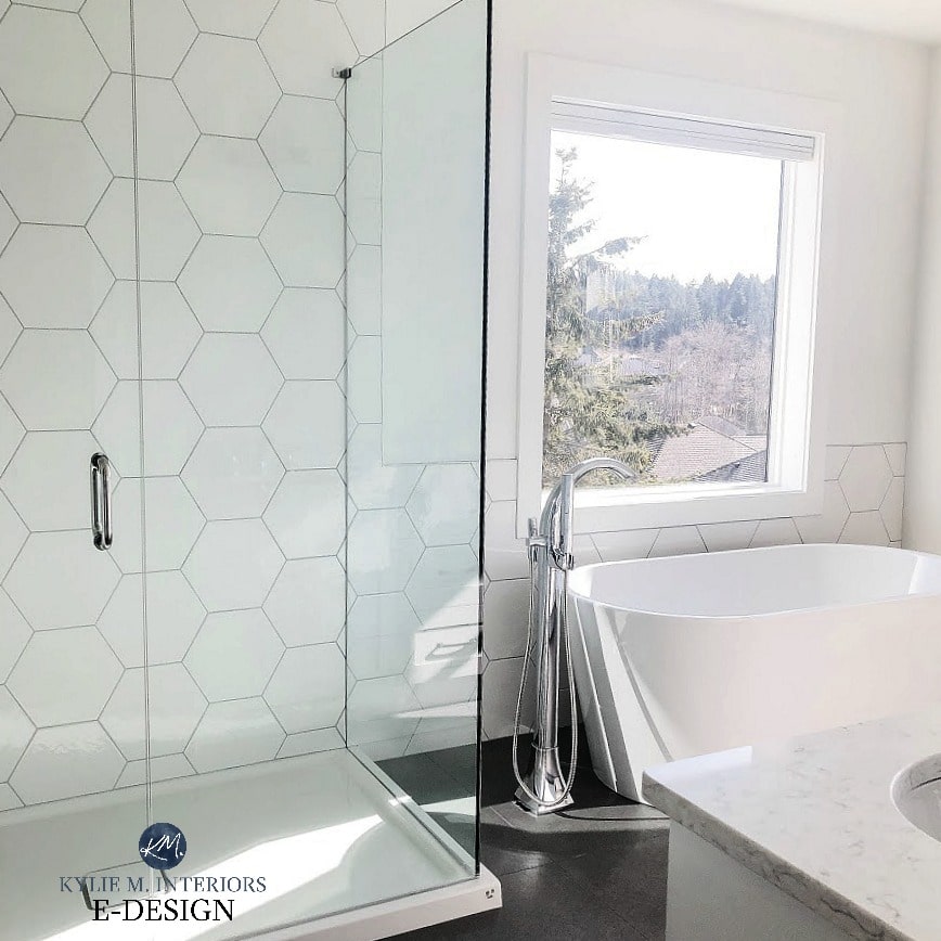 Master bathroom, white hexagon tile shower walls, fibreglass floor, LG quartz countertop, Pure white walls, freestanding tub. Kylie M INteriors Edesign,