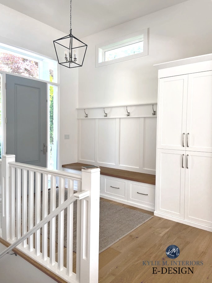 Benjamin Moore Super white walls, trims, and bench at front door with Sherwin Williams Gris and oak flooring