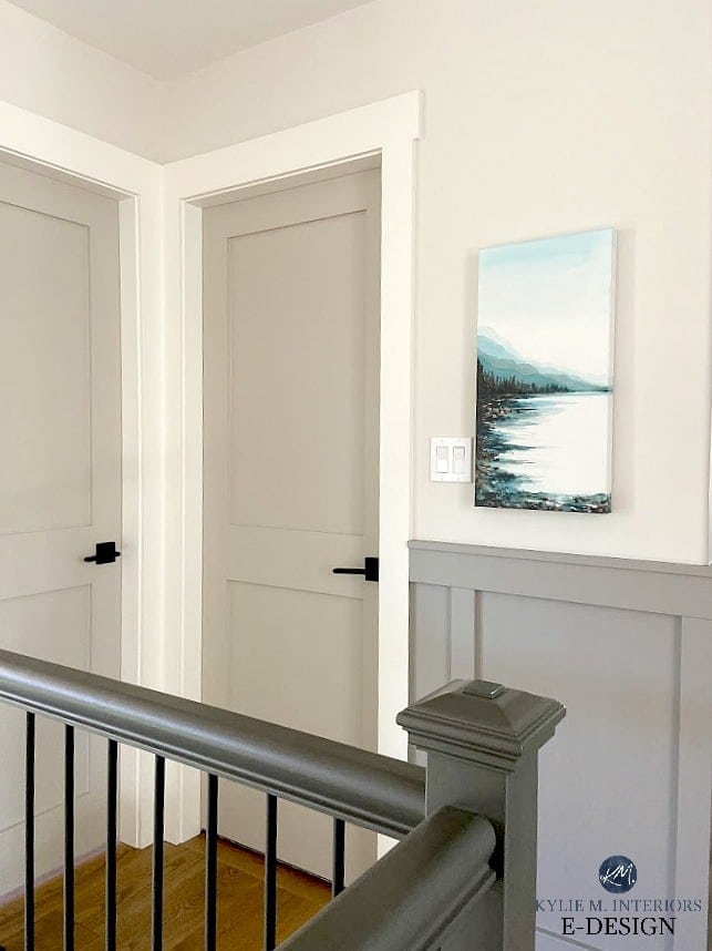 Hallway with board and batten, painted interior doors and stair railing. West coast art by Ronei. Greige, gray palette. Kylie M Interiors Edesign, online paint colour consultant and diy blog