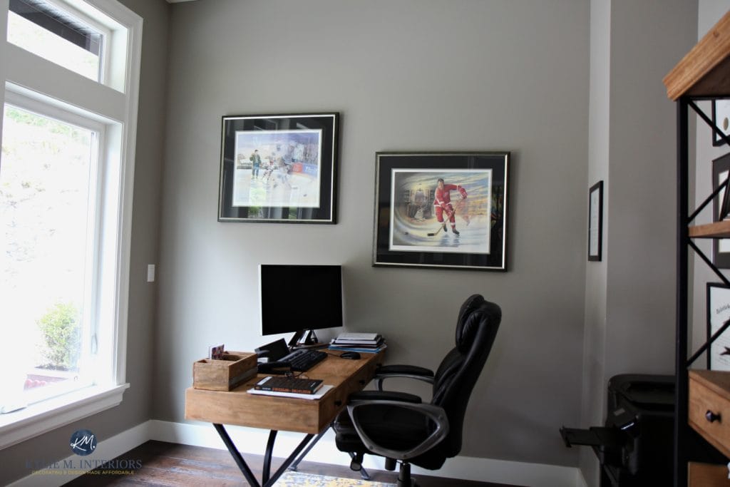 Sherwin Williams Fawn Brindle in a mans office with dark wood flooring and white trim. 