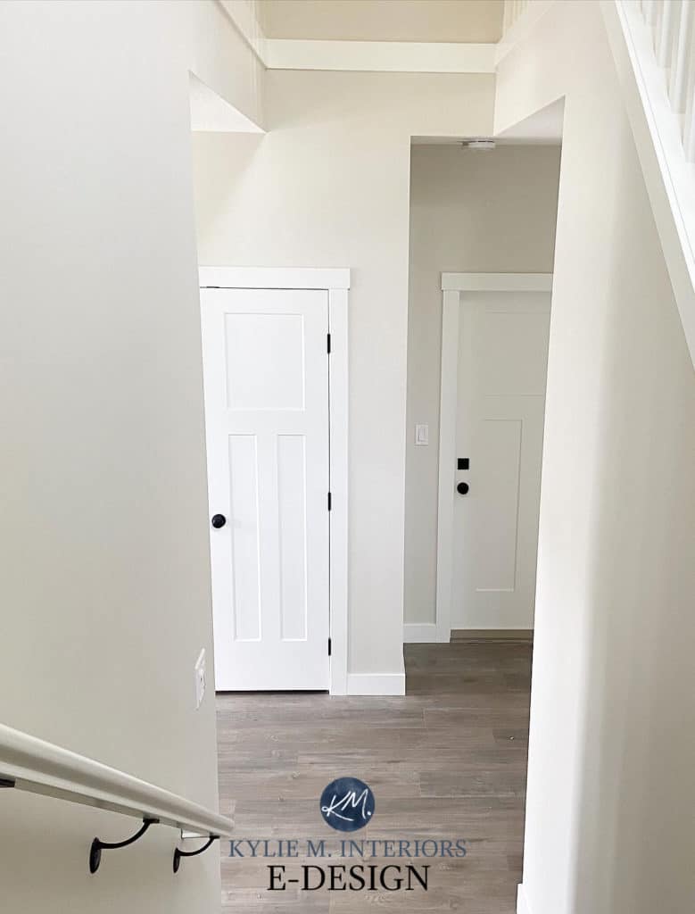 Benjamin Moore Classic Gray. Popular warm gray and off-white paint colour. Gray wash laminate wood flooring and white trim. Kylie M Interiors E-Design, online paint colour advice and blogger