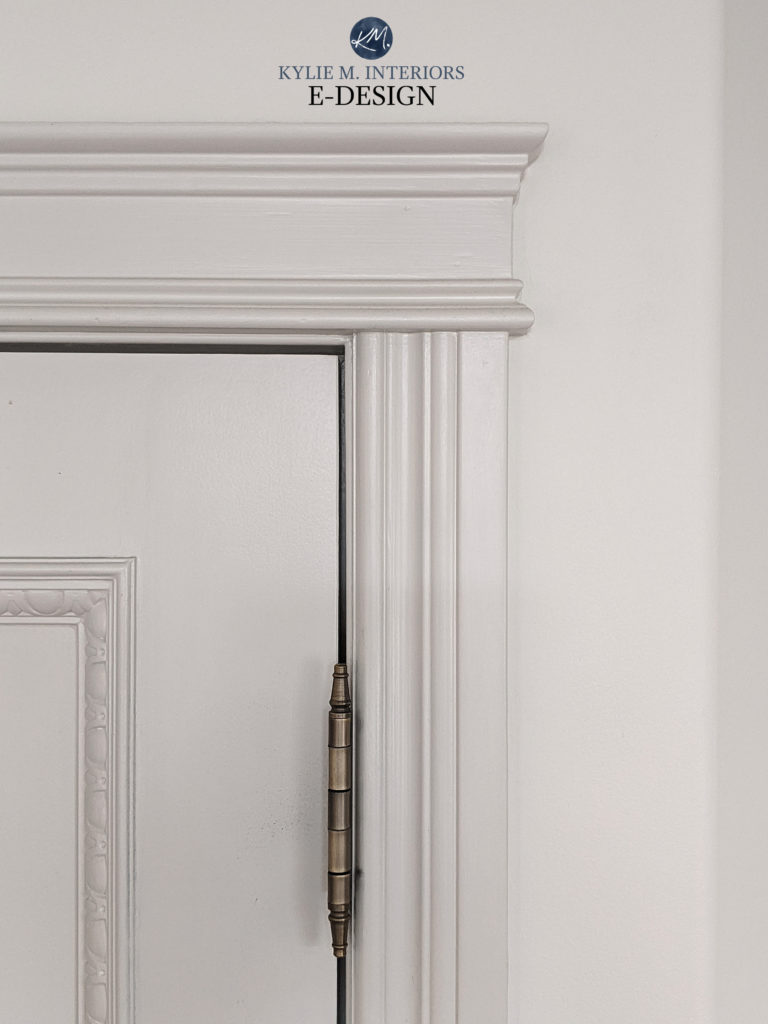 Kylie M Interiors Edesign, oak cabinets painted Sherwin Williams Pure White Cybersapce, white quartz countertop subway tile backsplash. Black appliances. Agreeable Gray paint color