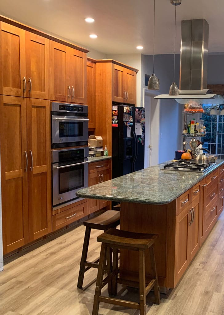 Painted wood cabinets BEFORE edesign with green toned granite. (1)