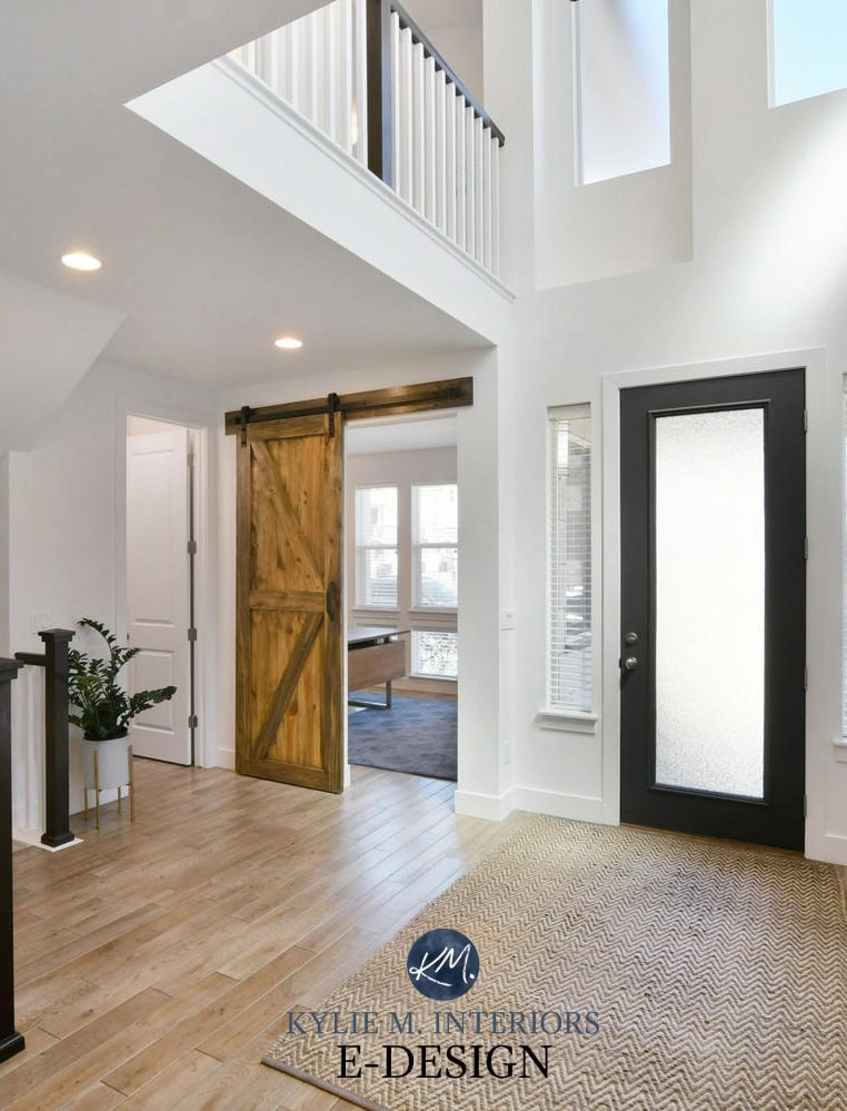 2 storey entryway or foyer, white walls, Sherwin Williams Pure White, black front door, wood stairs, sliding barn door. Kylie M Interiors Edesign, online paint colour, virtual diy decorating ideas (2)