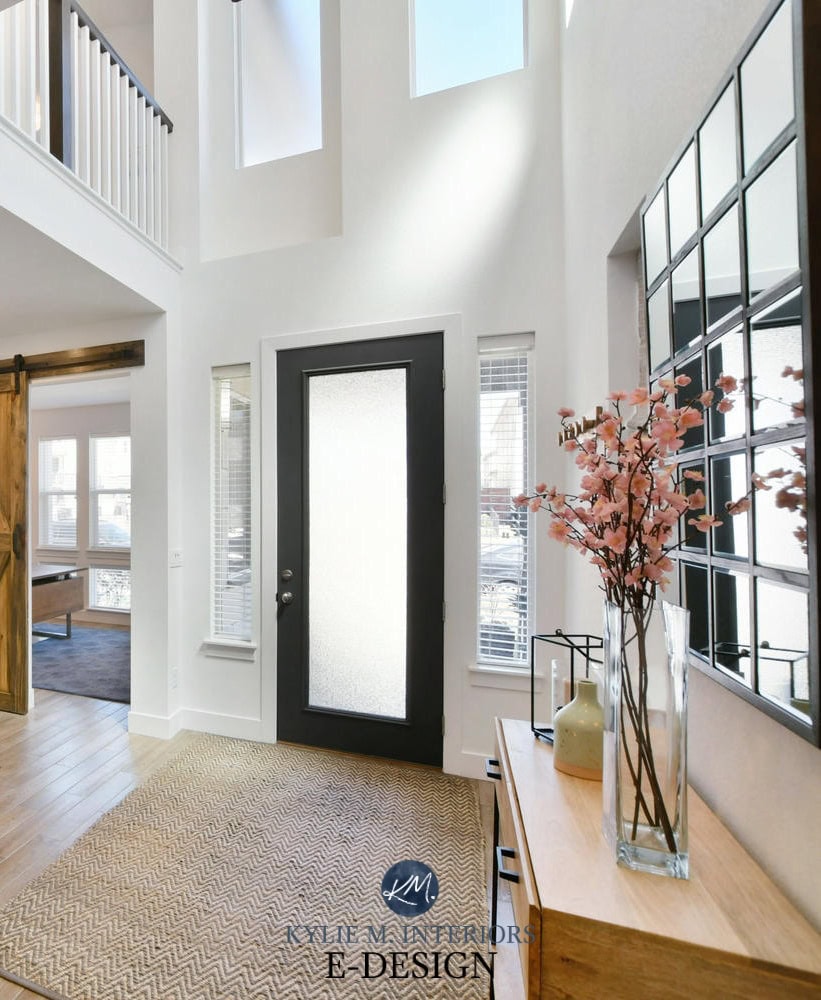 2 storey entryway or foyer, white walls, Sherwin Williams Pure White, black front door, wood stairs, sliding barn door. Kylie M Interiors Edesign, online paint colour, virtual diy decorating ideas