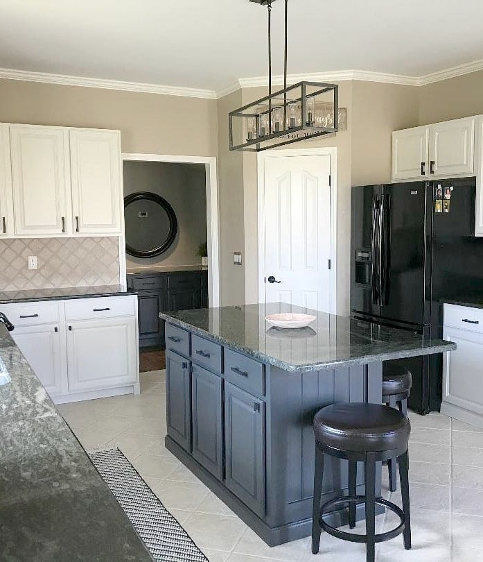 Kitchen update ideas. Black appliances, green granite, off-white painted maple cabinets and black island. Travertine and beige floor tile. Balanced Beige walls. Kylie M Interiors Edesign