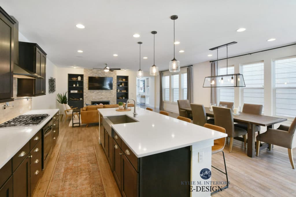 Open layout dining room, kitchen dark wood cabinets, tile wood look floor. Sherwin Williams Pure White. Paint color consulting Kylie M Interiors Edesign 