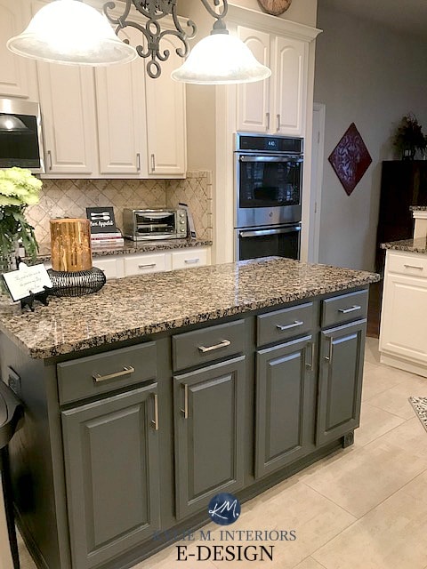 Kylie M Interiors Edesign, painted oak cabinets, dark green gray island off-white cabinets. Sherwin Williams. Travertine backsplash and green, orange, beige granite countertop. Kilim Beige