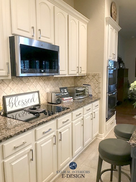 Painted oak cabinets, Baltic Brown granite green countertop, travertine backsplash. Update ideas Kylie M Interiors Edesign. (3)