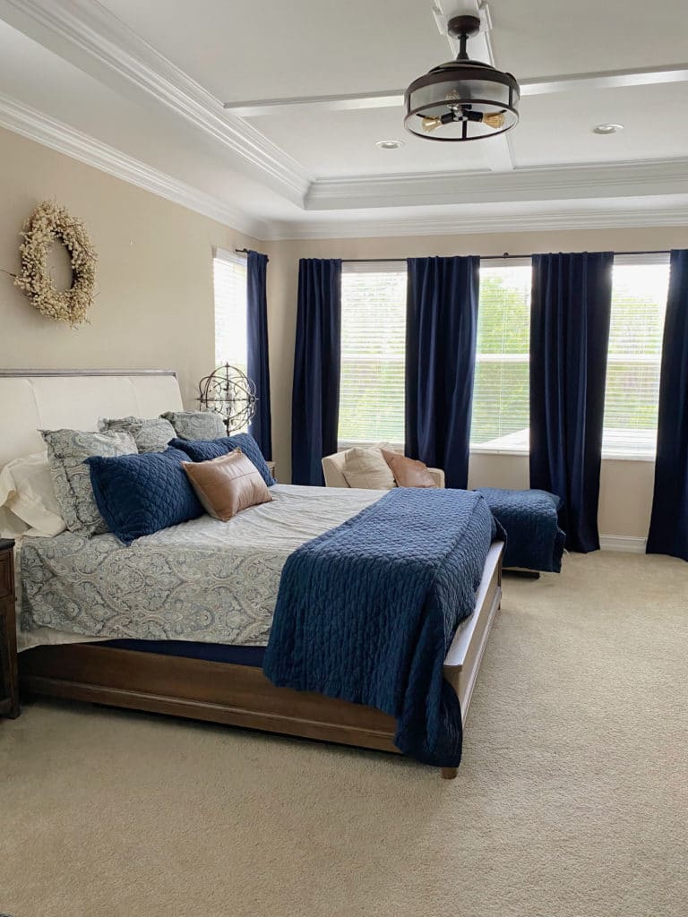 Sherwin Williams China Doll, best beige tan neutral paint color. Beige carpet, navy blue and orange accents. Kylie M Interiors online paint consulting. client photo