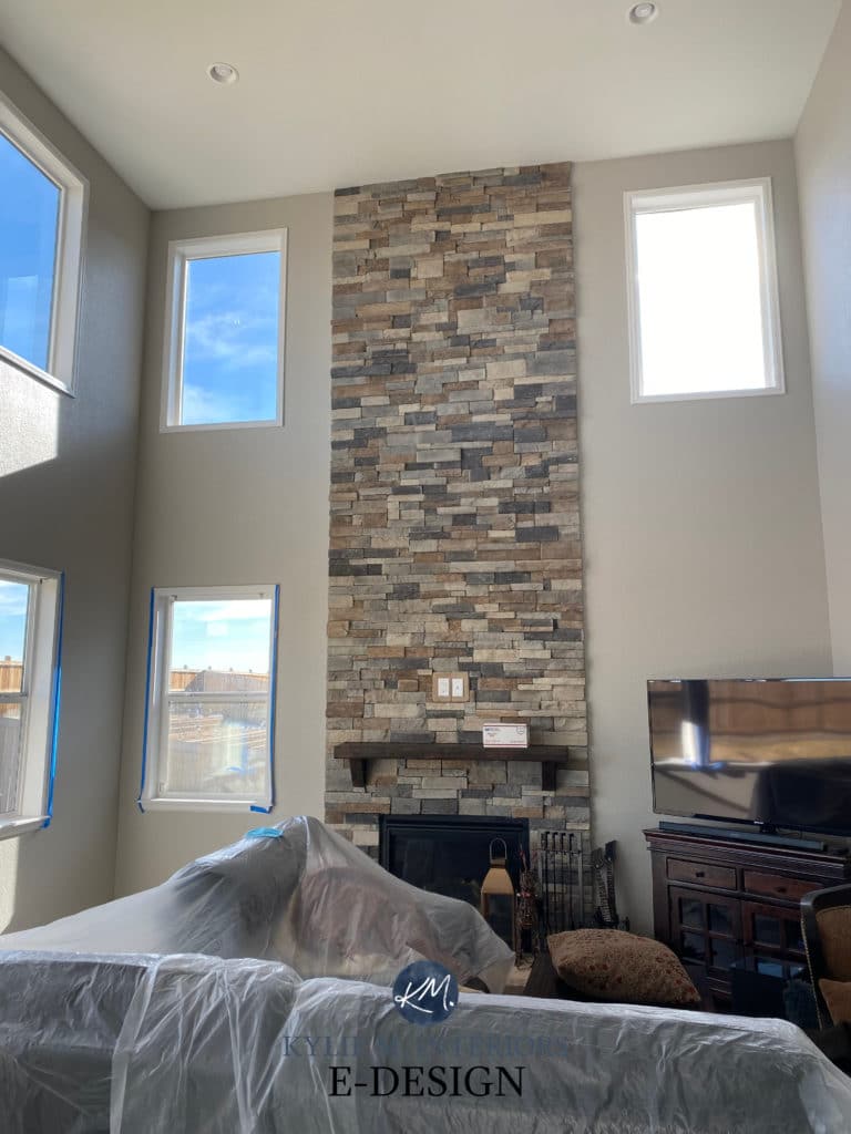 Stone fireplace, two-storey tall with Benjamin Moore London Fog, greige or taupe. Kylie M Interiors Edesign, online paint color consulting
