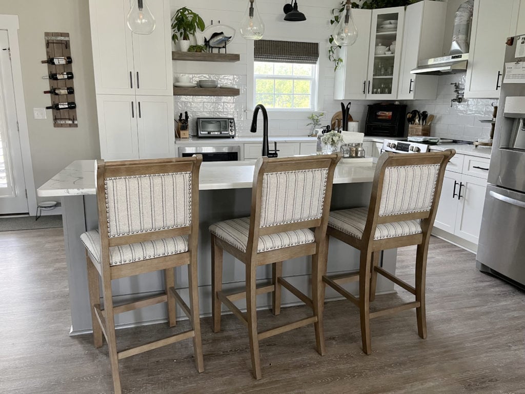 Sherwin Williams Dovetail painted gray island with white quartz, Agreeable Gray walls, Pure White kitchen cabinets, modern farmhouse style