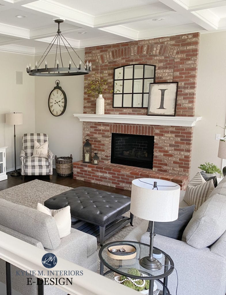 Family room, brick fireplace that's pink with greige walls, transitional style home decor, chandelier, white trim. Kylie M Interiors Edesign, diy decorating blogger
