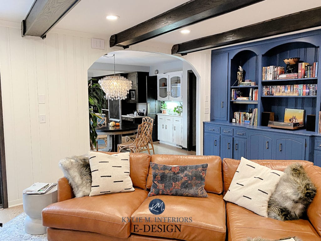 Van Deusen Blue painted built-in bookcase and Simply White. Dark wood beams, tobacco cognac leather sofa. Kylie M Interiors Edesign, diy advice, client phot