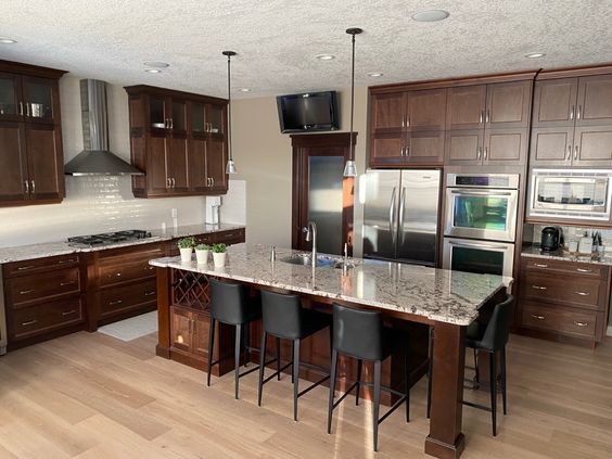Dark wood kitchen before cabinets painted with granite (2)