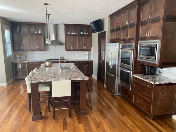 Dark wood kitchen before cabinets painted with granite (3)