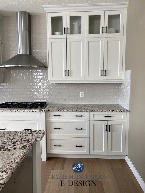 Maple wood cabinets painted Benjamin Moore Classic Gray. Warm grey. Backsplash is greige taupe subway tile, granite. Kylie M Interiors Edesign, diy blogger.