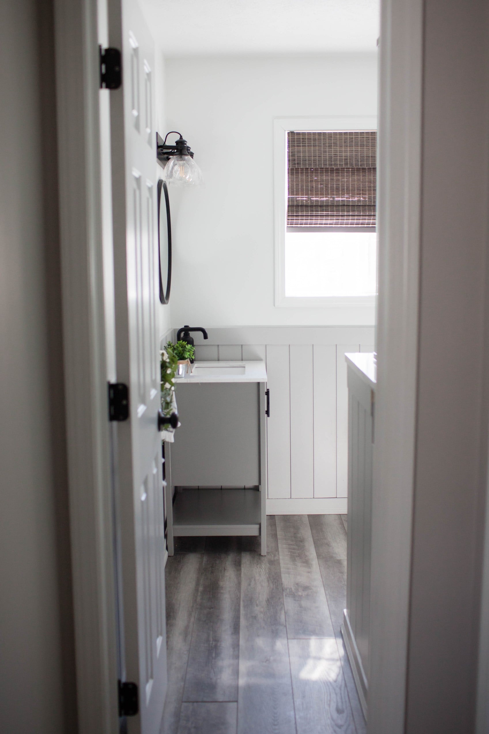 Sherwin Williams Light French Gray, Pure White, wainscoting, beadboard in small bathroom. Kylie M INteriors Edesign, client photos.